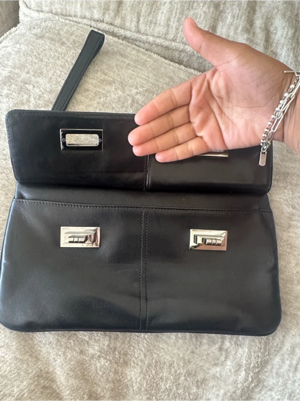CHANEL Black Leather Wristlet Clutch with Quilted Flap and Silver Turn Locks